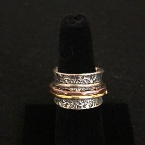 Silver spinner ring with two bands one is Copper and one is gold